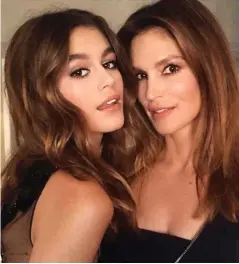  ??  ?? Lookalike: Kaia, left, with her mother Cindy Crawford