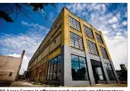  ?? NICK GRAHAM/STAFF ?? 80 Acres Farms is offffering produce pickups of tomatoes, saladmixes and other products in downtown Hamilton, at the former MiamiMotor Car Co. building at 319 S. 2nd St.
