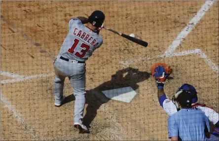  ?? FRANK FRANKLIN II - THE ASSOCIATED PRESS ?? Washington Nationals’ Asdrubal Cabrera (13) hits a two-run double during the seventh inning of a baseball game against the New York Mets, Sunday, Aug. 11, 2019, in New York.