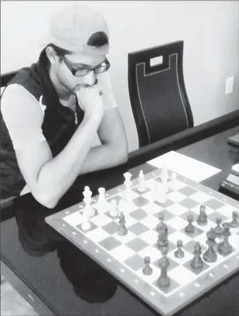  ??  ?? Chess player Rashad Hussein, one of Guyana’s sharper players, would love to witness more chess interactio­n among our Caricom neighbours. This would be an effective way of improving the quality of chess locally without digging deep into our pockets.