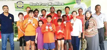  ??  ?? KTRS juniors with their parents, coach and supporters displaying their 11 medals