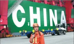  ?? YU FANGPING / FOR CHINA DAILY ?? A port worker at Qingdao, Shandong province, oversees dispatch of containers. From 2013 to 2016, China’s economy expanded by an average annual rate of 7.2 percent.