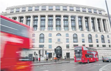  ?? REUTERS ?? Traffic and people pass by the front of the Unilever building in central London.