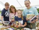  ??  ?? Martin Langdown, Sharon Thomas, her daughter, Carys Westcott (10) and Tony Westcott on the book stall