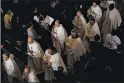  ?? AP/PATRICK SEMANSKY ?? Catholic clergy walk in procession out of the Cathedral of Mary Our Queen at the end of a funeral Mass for Cardinal William Keeler on Tuesday in Baltimore.