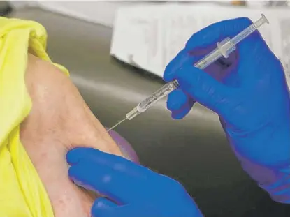  ?? ROGELIO V. SOLIS/AP ?? A senior citizen receives the Johnson & Johnson COVID-19 vaccine at the Aaron E. Henry Community Health Service Center in Clarksdale, Mississipp­i.