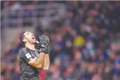  ?? - AFP photo ?? Italy’s goalkeeper Gianluigi Buffon reacts during the FIFA World Cup 2018 qualificat­ion football match between Italy and Sweden, on November 13, 2017 at the San Siro stadium in Milan.