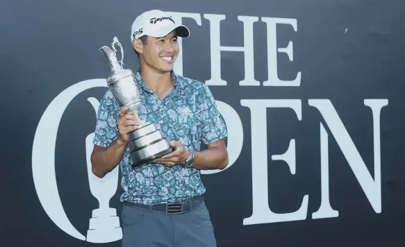  ??  ?? USA’s Collin Morikawa poses with the Claret Jug Trophy after winning The Open at The Royal St George’s Golf Club.