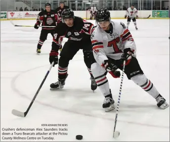  ?? KEVIN ADSHADE/THE NEWS ?? Crushers defenceman Alex Saunders tracks down a Truro Bearcats attacker at the Pictou County Wellness Centre on Tuesday.