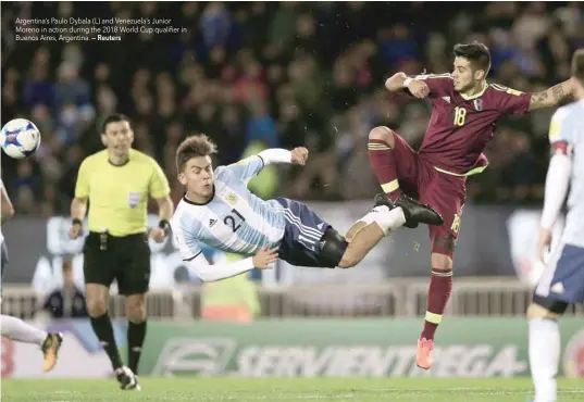  ?? — Reuters ?? Argentina’s Paulo Dybala (L) and Venezuela’s Junior Moreno in action during the 2018 World Cup qualifier in Buenos Aires, Argentina.