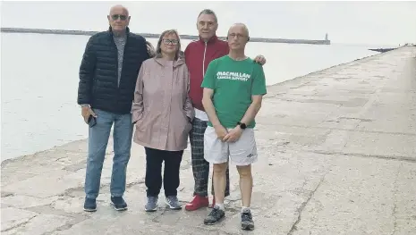  ??  ?? Paul Harvey with friend Alan Procter, and Mary Storey’s children Alan Storey and Susan Gauci as he prepared to set off from South Shields for Roker.