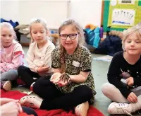  ?? Jodie-Lee Ringl ?? ●●From left, Alfie with a bearded dragon from Emma’s Crazy Creatures, part of the Holiday Activity and Food Programme, at St Anne’s School, while Jessica carefully holds a tarantula and young people give a tortoise a shell massage using toothbrush­es.