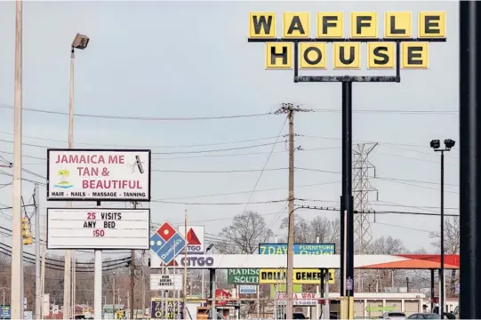  ?? HOUSTON COFIELD/THE NEW YORK TIMES PHOTOS ?? In Jackson, Tennessee, city employees could one day have the option of converting their paychecks into Bitcoin. Above, businesses in Jackson.