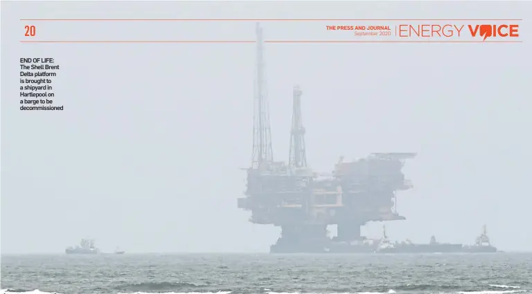  ??  ?? END OF LIFE: The Shell Brent Delta platform is brought to a shipyard in Hartlepool on a barge to be decommissi­oned