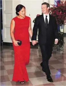  ?? Rex Features ?? Evolving views Facebook CEO Mark Zuckerberg with his wife Priscilla Chan. Zuckerberg’s views on parenting and working in Silicon Valley have changed with the Facebook CEO saying he will take two months of paternity leave after his daughter is born.