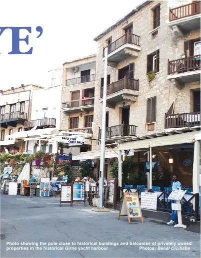  ?? Photos: Benal Cicibaba ?? Photo showing the pole close to historical buildings and balconies of privately owned properties in the historical Girne yacht harbour