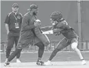  ?? DOUG ENGLE/GAINESVILL­E SUN ?? New Florida secondary coach Will Harris runs a drill with one of his defensive backs during spring football practice April 9.