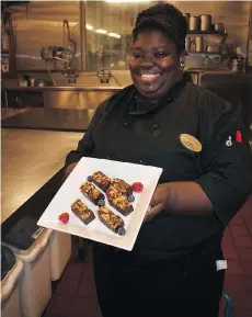  ??  ?? In the kitchen of the Palmer House Hilton, pastry cook Robin, left, prepares brownies using the recipe originally used at the 1893 Chicago World Fair.