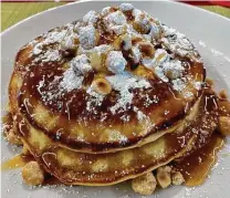  ?? Stephan Gristina ?? Caramel hazelnut pancakes are among the new brunch dishes at Weights + Measures in Midtown.