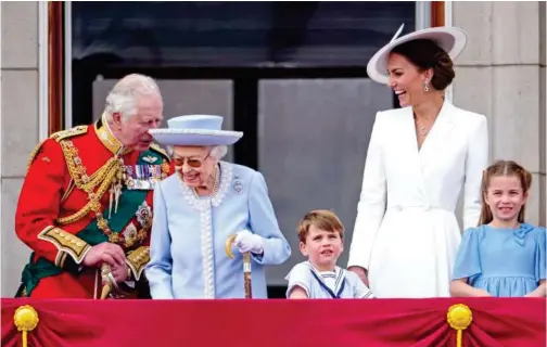  ?? Tribune News Service ?? Prince Charles (left), Prince of Wales, Queen Elizabeth II, Prince Louis of Cambridge, Catherine, Duchess of Cambridge and Princess Charlotte of Cambridge watch the RAF flypast on the balcony of Buckingham Palace during the Trooping the Colour parade in London, England.