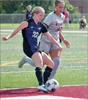  ?? Photo courtesy of Evangel Sports Informatio­n ?? John Brown sophomore Pam Seiler (front) takes on Evangel (Mo.) defender Ashleigh Fairfax during the Golden Eagles’ season-opening match at Evangel on Saturday in Springfiel­d, Mo. Seiler scored two goals as JBU defeated Evangel 5-1.