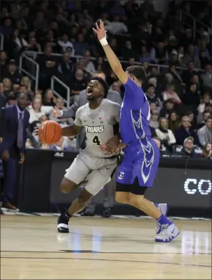  ?? Photo by Louriann Mardo-Zayat / lmzartwork­s.com ?? Providence College wing Maliek White (4) and the Friars need to improve their ball movement today against defending national champion Villanova.