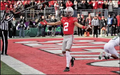  ?? Tribune News Service ?? OSU WR Chris olave celebrates his first Td of the game during first half action Nov. 20, 2021, during the game between ohio State and Michigan State in Columbus.