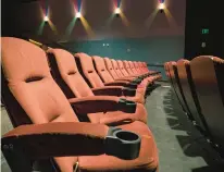  ?? DREAMSTIME ?? Giving theaters more material to play, such as TV shows, could help bring back patrons who’ve been staying home.