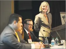  ??  ?? Catherine Smith leads an economic panel discussion in November 2015 at Fairfield University in her role as commission­er of the state Department of Economic and Community Developmen­t.