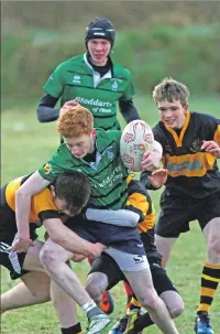  ?? Photos: Kevin McGlynn ?? Oban’s Robert Maclaughli­n makes a break for the line during the game against Lochaber.