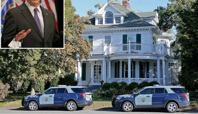  ?? STuART CAHiLL pHoTos / HeRALd sTAff fiLe ?? ‘FREE THEM ALL’: State Police vehicles park in front of Gov. Charlie Baker’s house Oct. 14. after a man broke into his house while his wife and daughter were home.