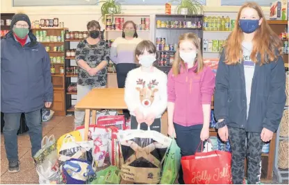  ??  ?? Donation District commission­er Jane Cepok and Piper Monie, Molly Keron and Maisie Fossett of Strathearn Pony Club drop off donations to Crieff Community Foodbank on behalf of SPC members. They are pictured with foodbank volunteers Tina McRorie and Lorraine Cummings