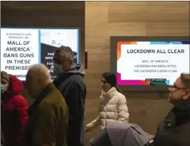  ?? ALEX KORMANN — STAR TRIBUNE FOR THE ASSOCIATED PRESS ?? Shoppers exit the Mall of America after the all clear was given and they were released from a lockdown following a shooting Friday in Bloomingto­n, Minn.