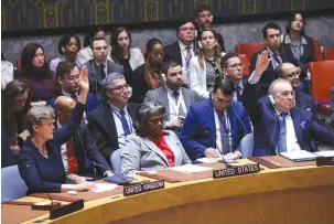  ?? (Andrew Kelly/Reuters) ?? US AMBASSADOR to the United Nations Linda Thomas-Greenfield is flanked by the Algerian and UK representa­tives who voted on Monday in favor of a Security Council resolution demanding an immediate Gaza ceasefire and the immediate and unconditio­nal release of all hostages. The US abstained.