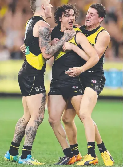  ?? Picture: ALEX COPPEL ?? GOAL FEAST: Dustin Martin, Daniel Rioli and Jason Castagna celebrate a goal.