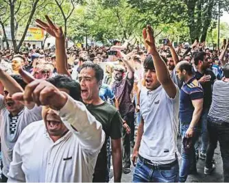  ?? AFP ?? Protesters chant slogans at the Grand Bazaar during yesterday’s demonstrat­ion in Tehran.