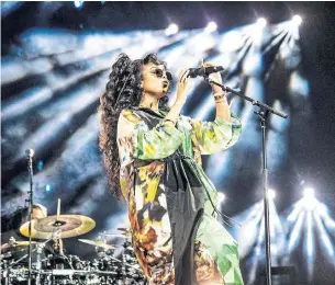  ?? AMY HARRIS INVISION/THE ASSOCIATED PRESS ?? The singer’s slow and steady career growth over the past three years has been not only a purposeful, but cherished pace. “Good things take time,” H.E.R. said.