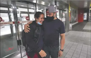  ??  ?? Celestina Ramirez (left), a migrant from Honduras, is hugged by her brother Marco Ramirez after they were reunited at BaltimoreW­ashington Internatio­nal Thurgood Marshall Airport, in Linthicum, Md., March 24. The siblings had not seen each other in 14 years.