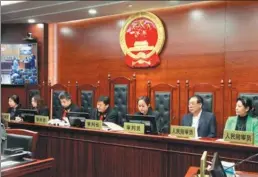  ?? PROVIDED TO CHINA DAILY ?? Diao Quangui (second from right) hears an air pollution case with three other people’s assessors and three judges at Beijing No 4 Intermedia­te People’s Court on May 8.