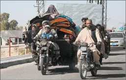  ?? GETTY-AFP ?? People flee Monday from Afghanista­n’s Helmand province amid clashes between Taliban fighters and Afghan security forces. Violence across the country has ticked up recently.