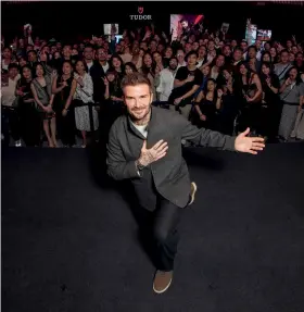  ?? ?? Clockwise from top left Beckham taking a wefie with the assembled guests; another on-stage photo; the dance troupe after their performanc­e
Opposite page Beckham at the TUDOR boutique at Pavilion Damansara