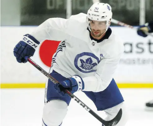  ?? DAVE ABEL / POSTMEDIA NEWS ?? Newly-acquired Toronto Maple Leaf John Tavares intercepte­d two passes on his first practice shift and later scored a goal.