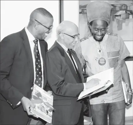  ?? ?? Trinidad and Tobago Chief Justice Ivor Archie, Nasser Khan and Lutalo Masimba (Brother Resistance) at the launching of the book, 22nd November, 2016