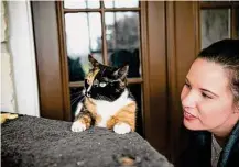  ?? ?? Gerber plays at home in Richmond with her cat, Petie, whom she rescued while working at Katy Animal Control.