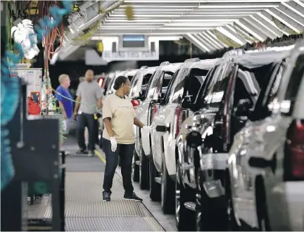  ?? LM OTERO/AP FILES ?? An autoworker inspects finished SUVs at the General Motors plant in Arlington, Texas. After little progress following five rounds of NAFTA negotiatio­ns, Canadian officials say that the country is ready to shift its approach on the contentiou­s issue of...
