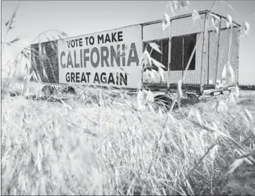  ?? Tomas Ovalle For The Times ?? A SIGN alludes to President Trump’s campaign slogan along Highway 41, south of Hanford. For years, Democrats have unsuccessf­ully targeted Republican Reps. Jeff Denham and David Valadao in the Central Valley.