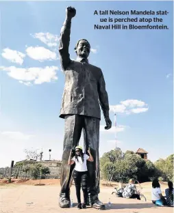  ??  ?? A tall Nelson Mandela statue is perched atop the Naval Hill in Bloemfonte­in.