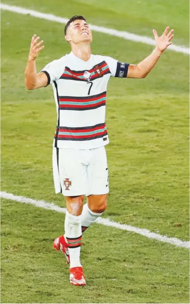  ?? Associated Press ?? Portugal’s Cristiano Ronaldo reacts in frustratio­n after his team lost the Euro 2020 round of 16 match against Belgium on Sunday.