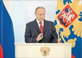  ?? Alexei Druzhinin Pool Photo ?? RUSSIAN President Vladimir Putin delivers his state of the nation address at the Kremlin. “We don’t want confrontat­ion with anyone,” he was quoted as saying.