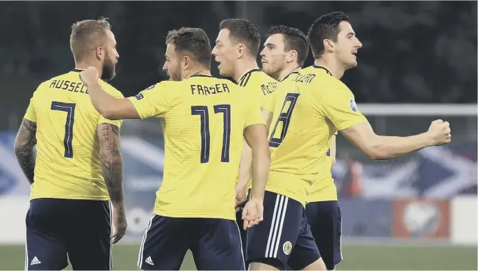  ??  ?? 2 Kenny Mclean, far right, celebrates his opener for Scotland last night but there was little for the Tartan Army to cheer after the early goal. Alex Mcleish, below, has appealed to Scotland fans to “stick by the team” despite a dismal start to the Euro qualifying campaign.